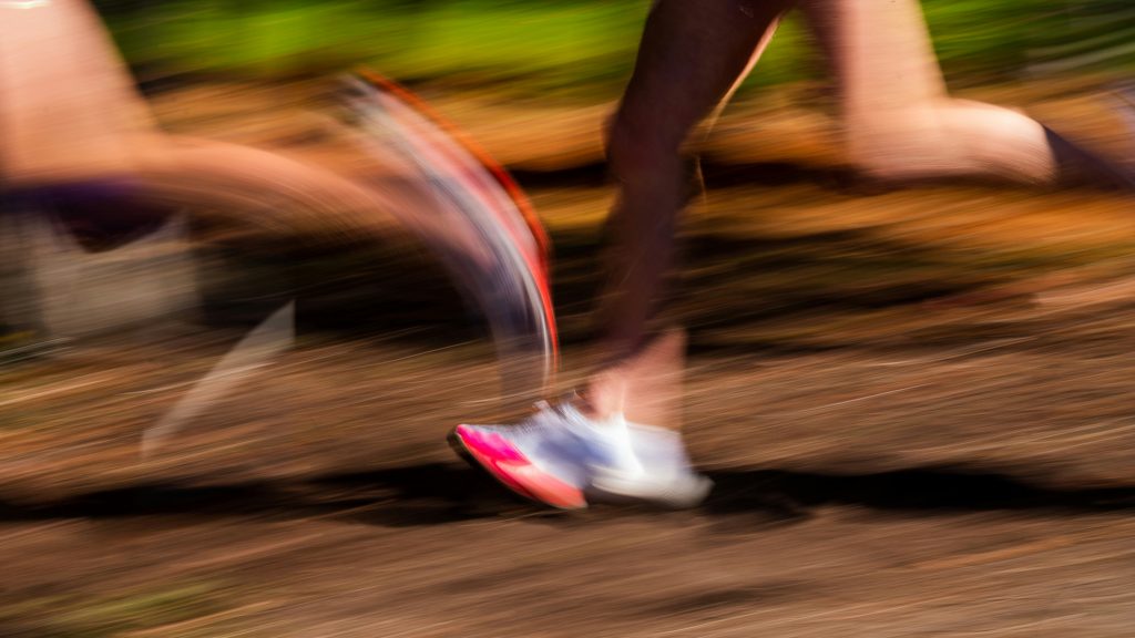 Woman running on a road